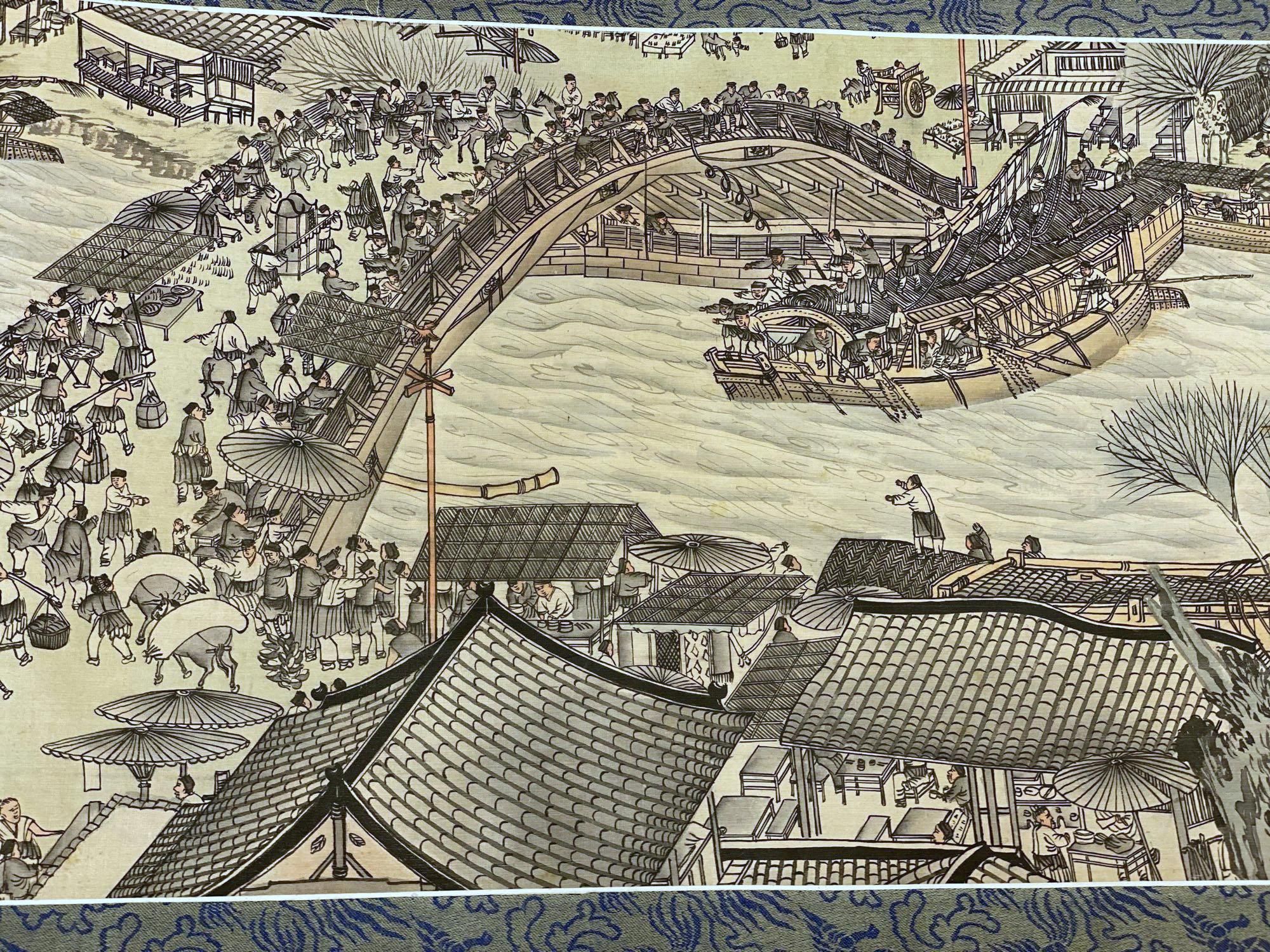 A Chinese landscape painting on silk handscroll with script, approximately 520 x 22cm